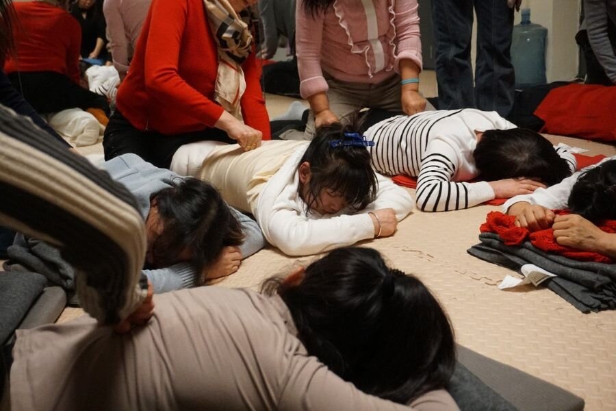 In the mental and physical health workshop organised by Hongyan Social Work Service Centre, domestic workers massage each other to alleviate pain.